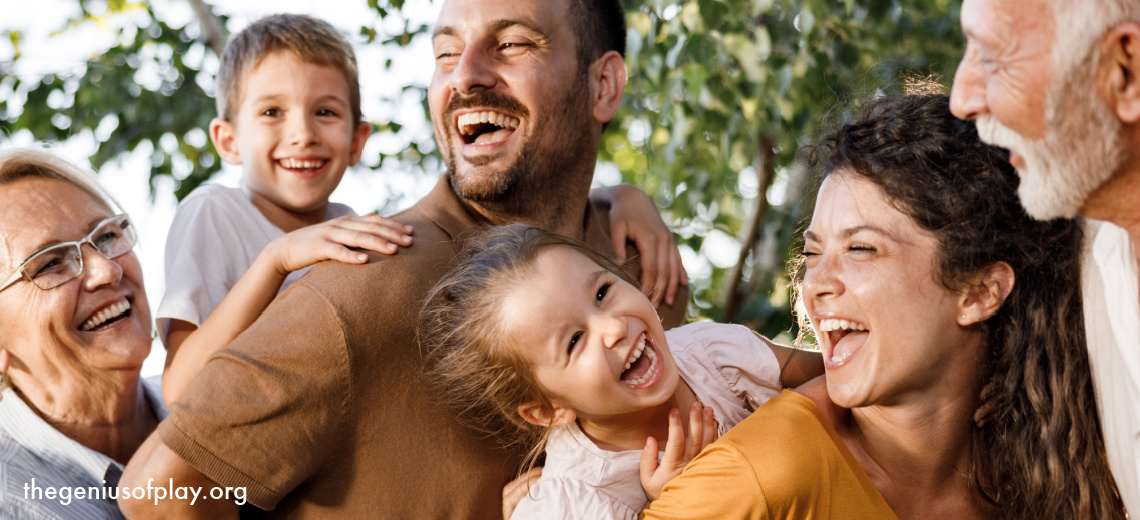 cheerful multi-generational family laughing and having fun outdoors 